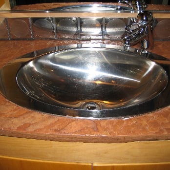 Tight Lines Construction - Flagstone vanity top and  custom curved cabinet - General Contractors Near Me