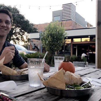 The Bread & Board - Outdoor seating area with fairy lights in the back ground - Sandwiches Near Me - Jacksonville, Florida The Bread & Board - Outdoor seating area with fairy lights in the back ground - Sandwiches Near Me - Jacksonville, Florida