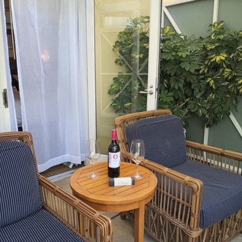 Pavilion Hotel - Enjoying wine and chocolate in front patio of our cozy room. - Hotels Near Me - Avalon, California Pavilion Hotel - Enjoying wine and chocolate in front patio of our cozy room. - Hotels Near Me - Avalon, California