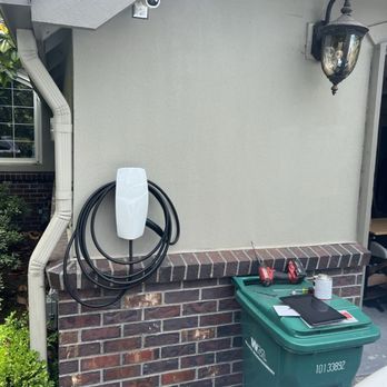 Machias Electrical and Power Generation - Tesla universal charger on stucco building - Electricians Near Me - Snohomish, Washington