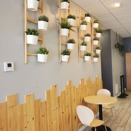 a restaurant with wooden tables and chairs a restaurant with wooden tables and chairs