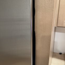 The gasket is sticking out around the entire fridge. Due to the pinched water line and electric plug not being routed/plugged in all the way