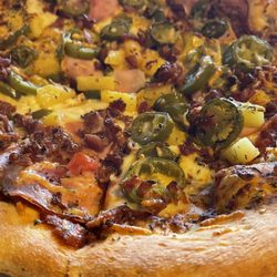Harriet's - Hawaiian with bacon and jalapeños.