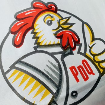 PDQ Chicken - a chicken holding a knife and fork - Chicken Shop Near Me - Deerfield Beach, Florida