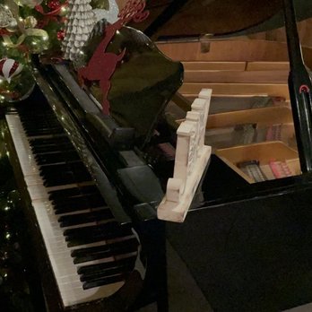 The Local on 17 - 25k for this piano. Owner frowns on sitting a drink on it. Don't blame him! - Steakhouses Near Me - Richmond Hill, Georgia