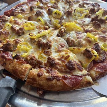 Out of Place Restaurant - a pizza with sausage and cheese - Salad Near Me - Garrison, Minnesota Out of Place Restaurant - a pizza with sausage and cheese - Salad Near Me - Garrison, Minnesota