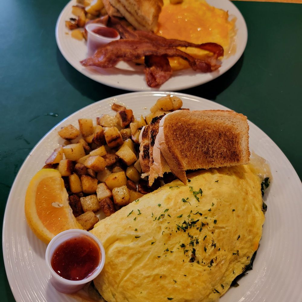 The Frog Pond - Spinach & Swiss omelette, home fries, toast, strawberry jam & orange slice. Scrambled eggs w/cheese, home fries, crispy bacon, toast & jam - Breakfast & Brunch Near Me - St Pete Beach, Florida The Frog Pond - Spinach & Swiss omelette, home fries, toast, strawberry jam & orange slice. Scrambled eggs w/cheese, home fries, crispy bacon, toast & jam - Breakfast & Brunch Near Me - St Pete Beach, Florida