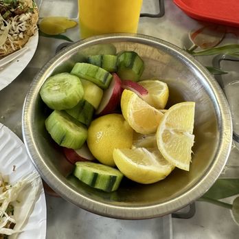 Little Mexico Chiquito - Salsa bottle, cucumbers, radishes and lemons. - Mexican Near Me - Maywood, California
