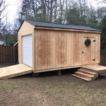 Backyard Paradise - Storage shed with roll up door - Fences & Gates Near Me - Leland, North Carolina Backyard Paradise - Storage shed with roll up door - Fences & Gates Near Me - Leland, North Carolina