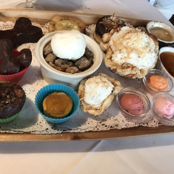 Yellow Dog Cafe - This is the fake dessert tray to explain all these desserts. - Seafood Near Me - Malabar, Florida Yellow Dog Cafe - This is the fake dessert tray to explain all these desserts. - Seafood Near Me - Malabar, Florida