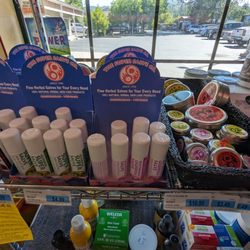 Sierra Hills Natural Foods - Nice selection of skin balm products in tins.