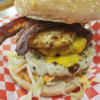 Falafel Corner - The BADMASH BURGER. This is one badass burger. Bacon, egg, double burger & cheese, all the fixings, and a spicy sauce - Mediterranean Near Me - Sacramento, California