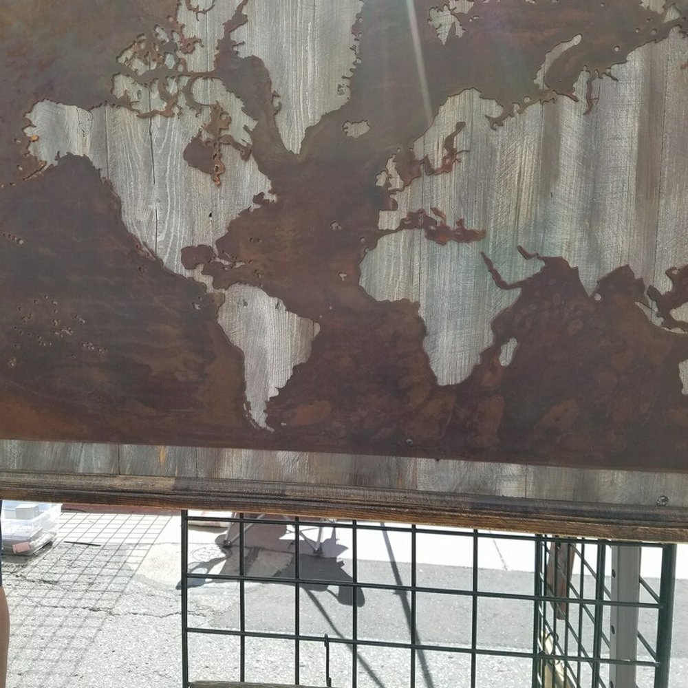 All About Pallets - A World Map ... carved rust metal on an off-white rustic wood frame. It's uuuuge. - Home Decor Near Me - Murray, Utah