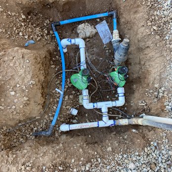 2 Hernandez Landscaping - a hole in the ground with pipes and pipes - Landscaping Near Me