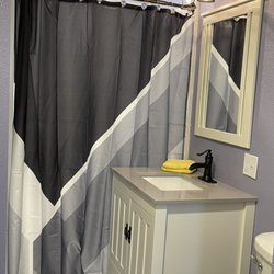 Fitzgerel's Nightly Rentals - The walk-in shower has a seat to relax and unwind after a long day.