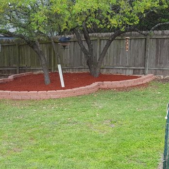 Landscaping...by Rigo - a garden with a tree and a bird feeder - Lawn Services Near Me - Manor, Texas Landscaping...by Rigo - a garden with a tree and a bird feeder - Lawn Services Near Me - Manor, Texas