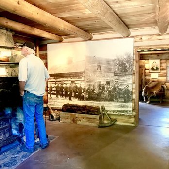 Genoa Town of - 6/18/2018-Pony Express Route, Mormon Station Museum, Genoa NV:  Man is admiring the 1851 shotguns. - Hiking Near Me - Genoa, Nevada