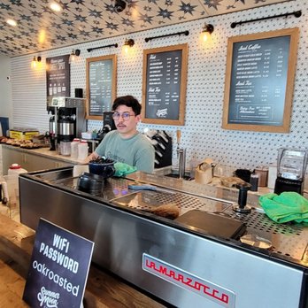 Summer Moon Coffee - a man behind the counter - Coffee Roasteries Near Me - Round Rock, Texas Summer Moon Coffee - a man behind the counter - Coffee Roasteries Near Me - Round Rock, Texas