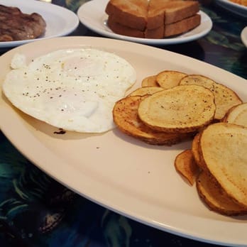 Lily's Beachside Restaurant - Ribeye steak with eggs, home fries and toasts - Breakfast & Brunch Near Me - Satellite Beach, Florida Lily's Beachside Restaurant - Ribeye steak with eggs, home fries and toasts - Breakfast & Brunch Near Me - Satellite Beach, Florida