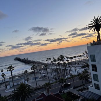 Mission Pacific Beach Resort - View of pier and sunset at Rooftop Bar - Resorts Near Me - Oceanside, California Mission Pacific Beach Resort - View of pier and sunset at Rooftop Bar - Resorts Near Me - Oceanside, California