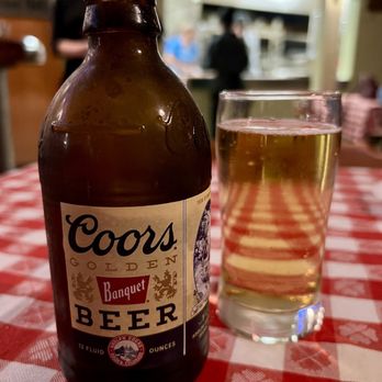 Fricano's Pizza Tavern - a bottle of beer and a glass of beer - Pizza Near Me - Grand Haven, Michigan Fricano's Pizza Tavern - a bottle of beer and a glass of beer - Pizza Near Me - Grand Haven, Michigan