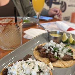 Steak taco, steak asada, skinny margarita w/ tajin rim, and mimosa.