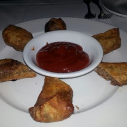 Cheese Steak Egg Rolls with spicy ketchup. Cheese Steak Egg Rolls with spicy ketchup.