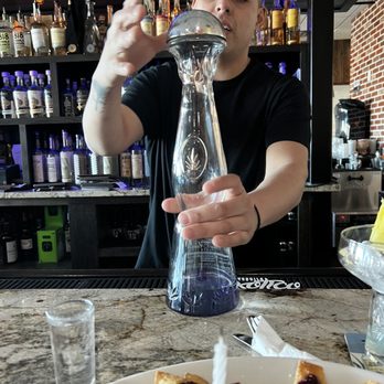 Taco Love Grill - a man pouring a drink - Mexican Near Me - White Marsh, Maryland