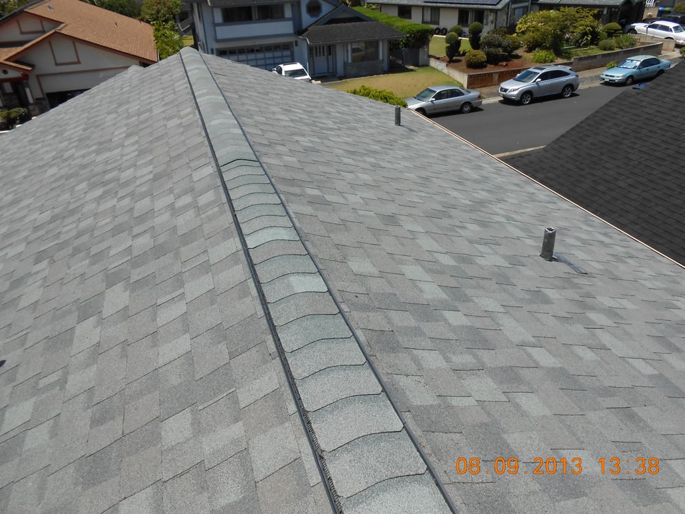 Slide of R.S. Toyama Roofing Service