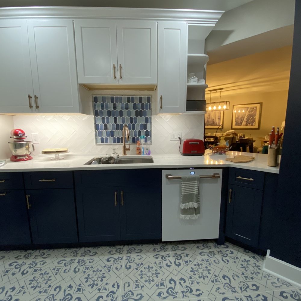 Birchtree Builders - a kitchen with blue and white cabinets - General Contractors Near Me Birchtree Builders - a kitchen with blue and white cabinets - General Contractors Near Me