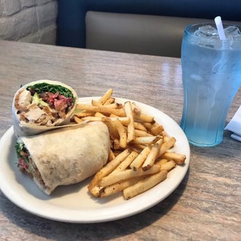 Perko's Cafe - Huge Ceasar Chicken wrap with seasoned french fries. And glass of water with ice. All very tasty good food. - New American Near Me - Jackson, California