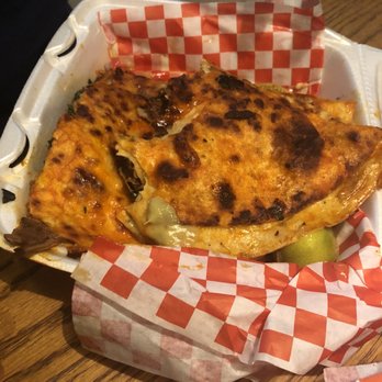 Tejas Birria - The quesadilla with onions and cilantro - Food Trucks Near Me - Buda, Texas