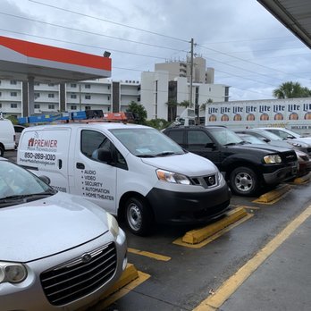Tom Thumb - a row of vehicles parked in a parking lot - Gas Stations Near Me - Santa Rosa Beach, Florida
