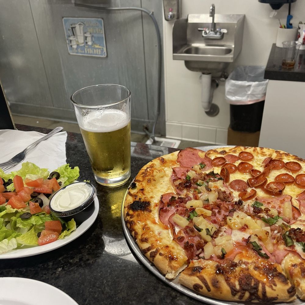 My Typhoon pizza scrumptious salad and of course, an ice cold beer. Everything tastes better with beer.