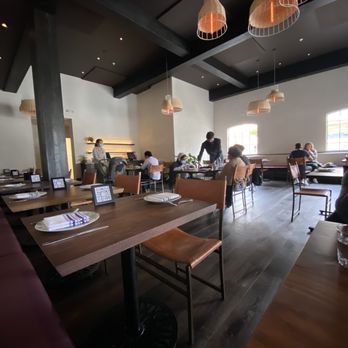 Aziza - Nearly evening, the natural light illuminates the dining area. At night, the vibe is an ultra low-light situation. Très romantic. - Moroccan Near Me - San Francisco, California