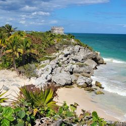Parque Nacional Tulum - The beach views here are truly panoramic, endless turquoise water, white sand, and horizon for days.