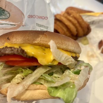What-A-Burger - ows a hand holding a hamburger - Burgers Near Me - Mooresville, North Carolina What-A-Burger - ows a hand holding a hamburger - Burgers Near Me - Mooresville, North Carolina