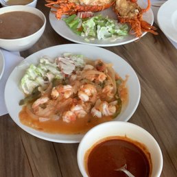 Top plate: Fish Filet a la plancha, Middle plate: Lobster combination with beans and rice, Bottom plate: shrimp a la diabla.