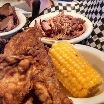 Mesquite Grill & Pub - Mixed skillet - chicken, pulled pork, brisket, ribs, baked beans, corn on the cob and a large basket of fries. - Barbeque Near Me - Thorp, Wisconsin Mesquite Grill & Pub - Mixed skillet - chicken, pulled pork, brisket, ribs, baked beans, corn on the cob and a large basket of fries. - Barbeque Near Me - Thorp, Wisconsin
