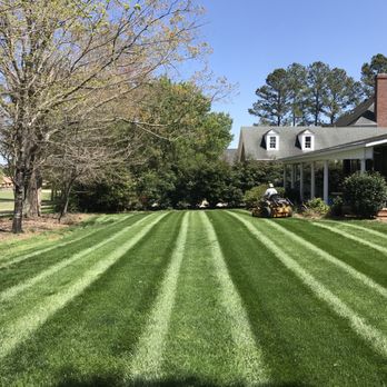 Turf Brothers - a man mowing the lawn - Lawn Services Near Me Turf Brothers - a man mowing the lawn - Lawn Services Near Me