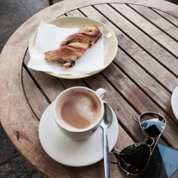 Cappuccino and Danish pastry. Cappuccino and Danish pastry.