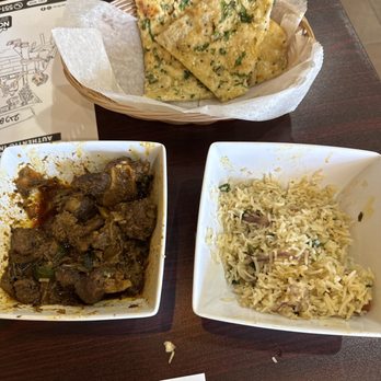Salkara - Goat curry, garlic naan, ghee rice with onions and cashews and raisins (not on the menu) - Indian Near Me - Nanuet, New York Salkara - Goat curry, garlic naan, ghee rice with onions and cashews and raisins (not on the menu) - Indian Near Me - Nanuet, New York