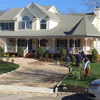 Hi-Tech Irrigation - a group of people in front of a house - Landscaping Near Me - Islandia, New York Hi-Tech Irrigation - a group of people in front of a house - Landscaping Near Me - Islandia, New York