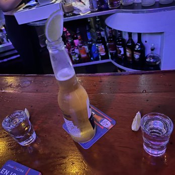 Marlin Club - a beer being poured into a bottle - Dive Bars Near Me - Avalon, California