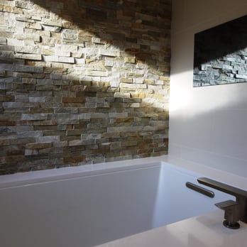 Brilliant Construction - This beautiful faucet took a lot of work to put on since the quartz slab was 3 cm thick.  Graeme engineered a solution for us. - General Contractors Near Me