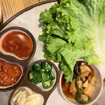 JCD Korean Restaurant - Dipping sauce & sides for lettuce wrapping of Jokbal & Soondae - Korean Near Me - Beaverton, Oregon JCD Korean Restaurant - Dipping sauce & sides for lettuce wrapping of Jokbal & Soondae - Korean Near Me - Beaverton, Oregon