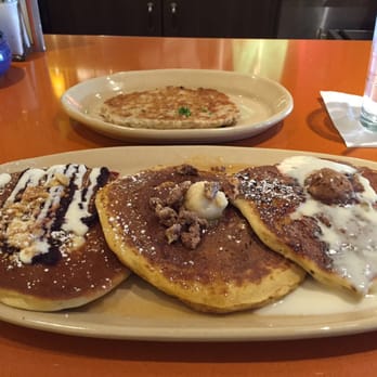 Snooze, an A.M. Eatery - Pancake flight (Blueberry Danish, Sweet Potato, & Pineapple Upside Down) with side chicken sausage patty.  Breakfast that eats like dessert - Breakfast & Brunch Near Me - Phoenix, Arizona