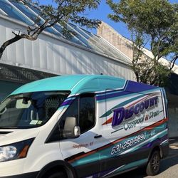 Discount Cesspool And Drain - Company truck with phone number