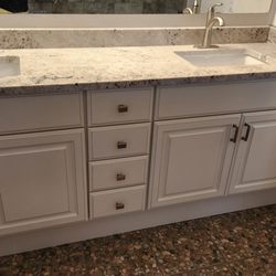 Stone City Az - Refinished bathroom with beautiful countertop and new doors.