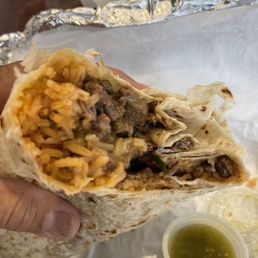 Asada burrito with homemade flour tortilla. Asada burrito with homemade flour tortilla.